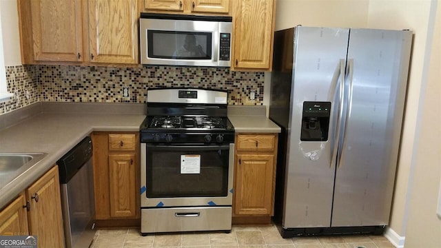 kitchen featuring backsplash and stainless steel appliances