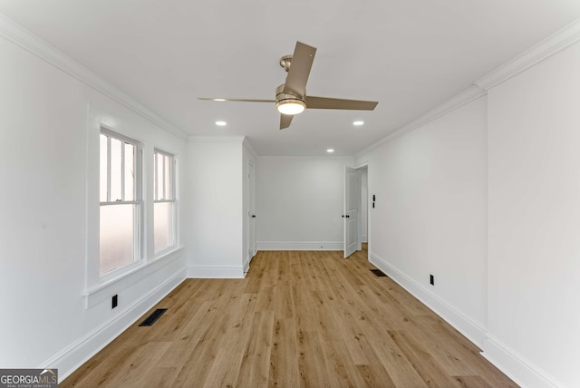 unfurnished room with crown molding, light hardwood / wood-style flooring, and ceiling fan