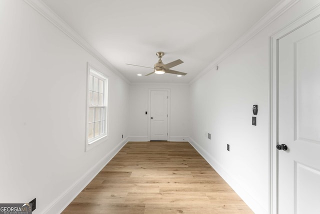 interior space featuring ceiling fan, light hardwood / wood-style floors, and crown molding