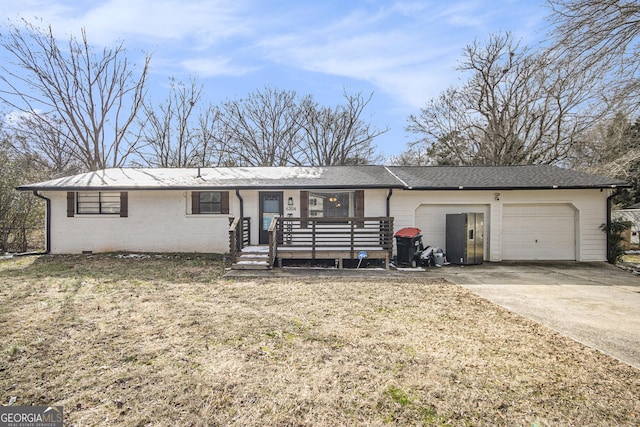 single story home with a garage and a wooden deck