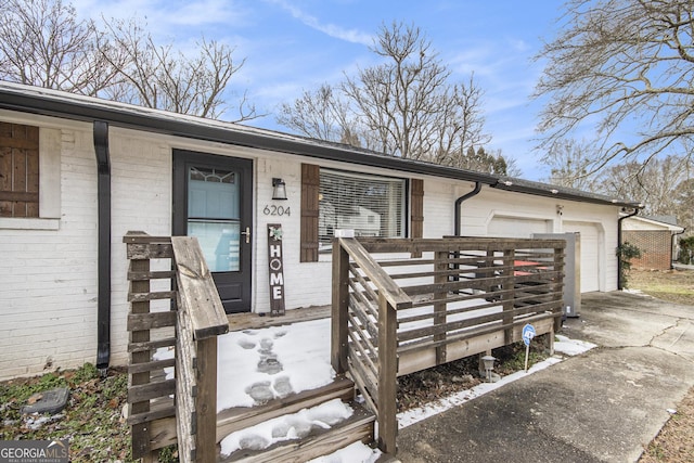 doorway to property featuring a garage