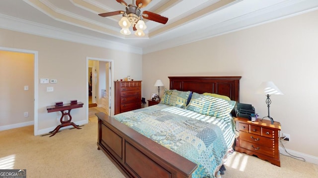 bedroom featuring a raised ceiling, crown molding, light colored carpet, and ceiling fan