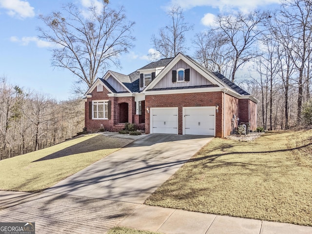 craftsman-style home featuring a garage and a front lawn