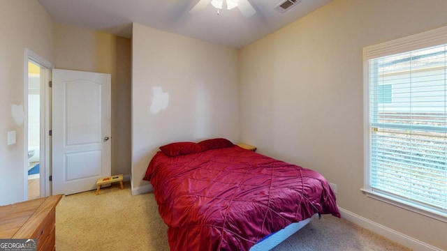 carpeted bedroom with ceiling fan