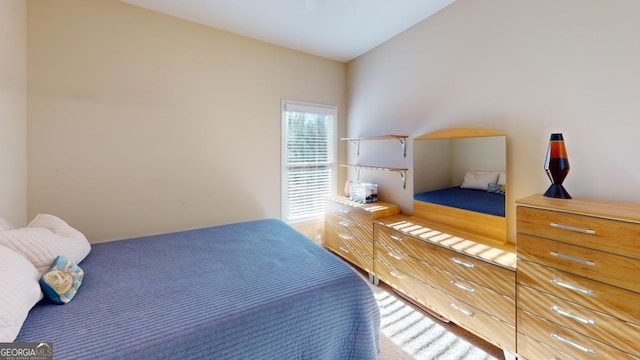 bedroom with vaulted ceiling