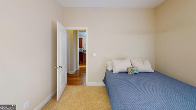 bedroom with light colored carpet