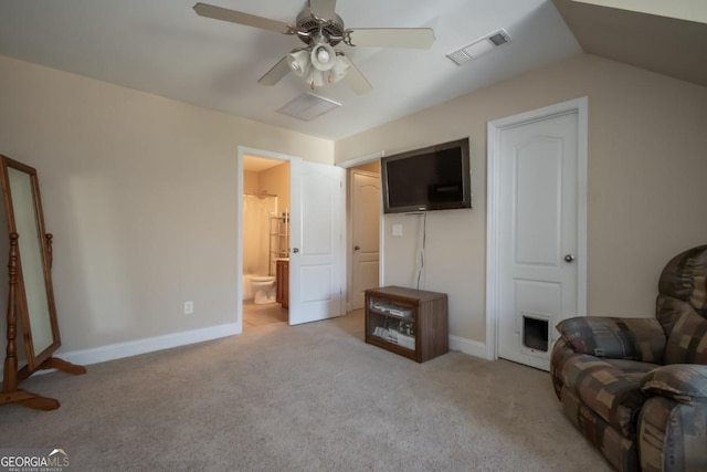 living room with ceiling fan, light colored carpet, and vaulted ceiling