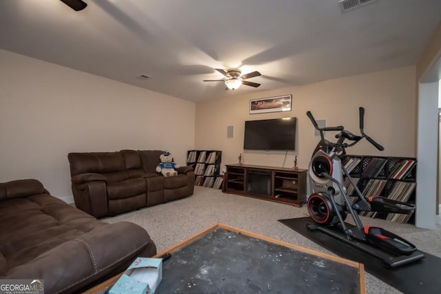 carpeted living room featuring ceiling fan