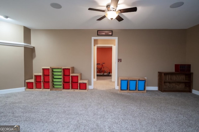 recreation room featuring ceiling fan and carpet flooring