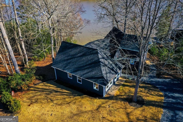 view of side of home with a lawn