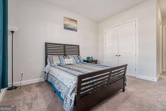 carpeted bedroom with a closet