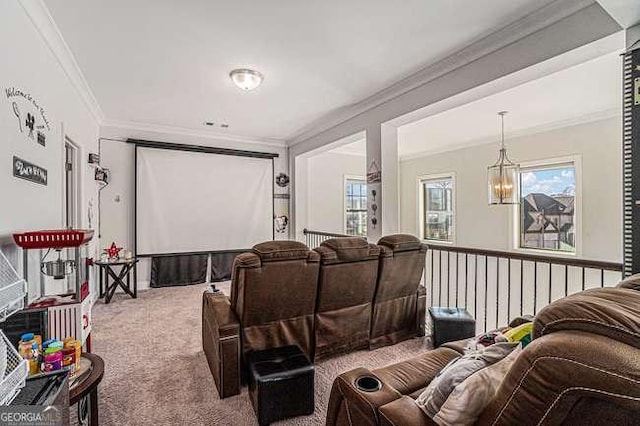 home theater featuring crown molding, carpet, and a chandelier