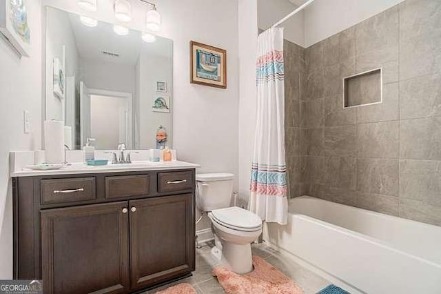 full bathroom with tile patterned floors, vanity, toilet, and shower / bathtub combination with curtain