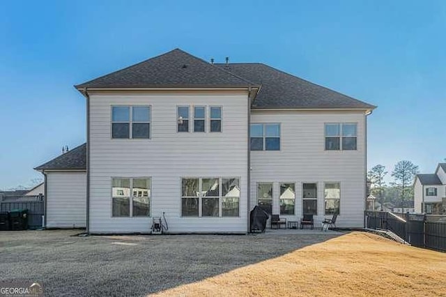 rear view of property featuring a patio