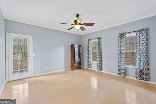 unfurnished room featuring light wood-type flooring and ceiling fan