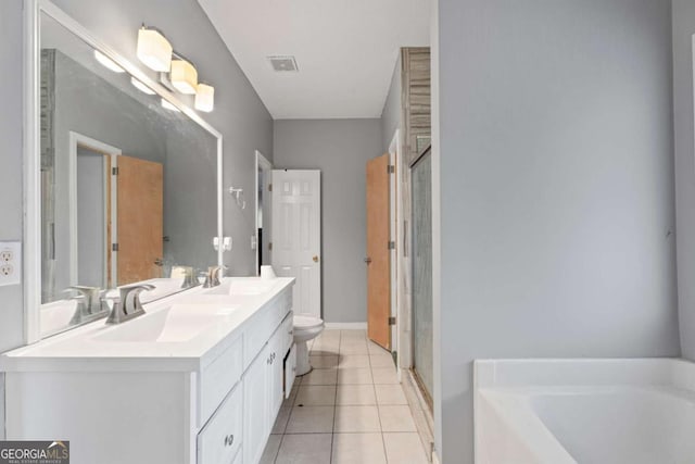 full bathroom featuring tile patterned flooring, vanity, toilet, and independent shower and bath