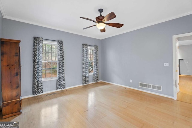 unfurnished room with light wood-type flooring, ceiling fan, and crown molding