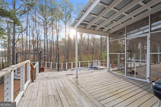 wooden terrace with a sunroom