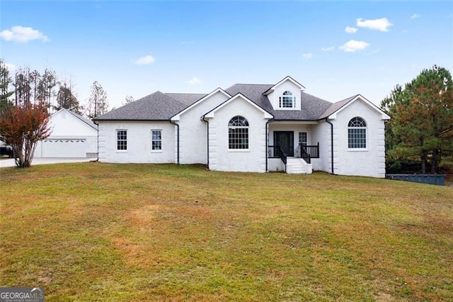 view of front of house with a garage and a front lawn