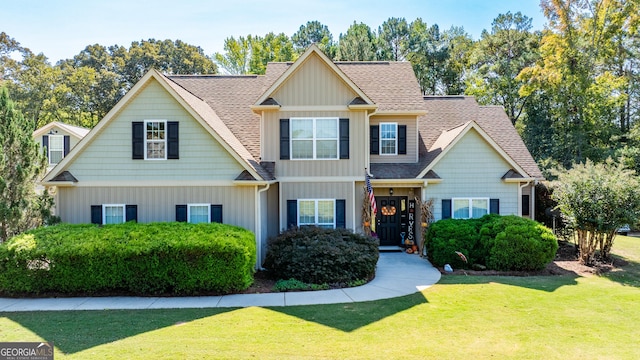 craftsman-style house with a front lawn and central air condition unit