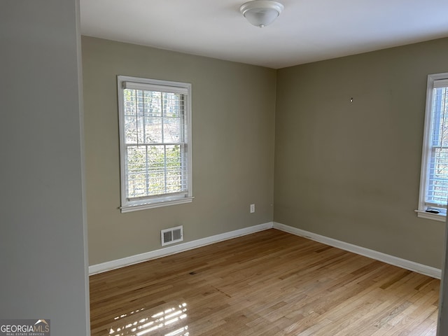 unfurnished room featuring light wood-type flooring