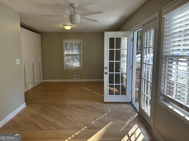 interior space with dark hardwood / wood-style floors and ceiling fan