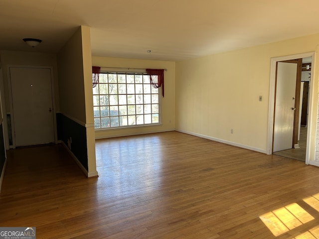 spare room featuring hardwood / wood-style floors