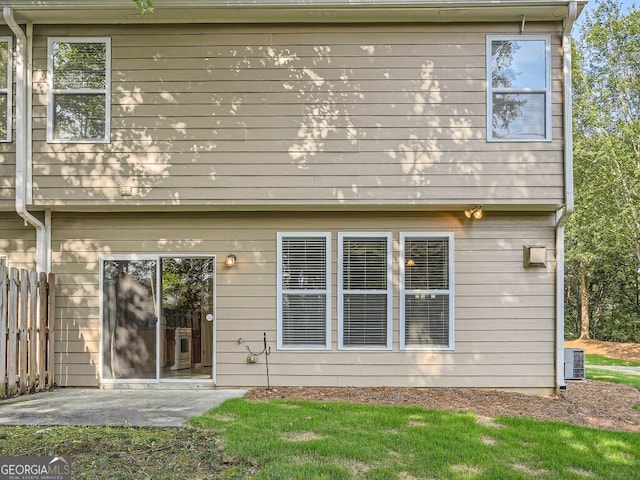 back of house featuring central air condition unit and a patio