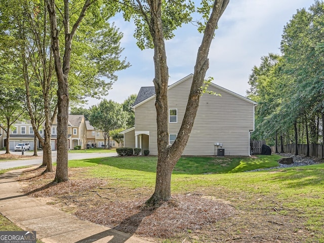 view of home's exterior featuring a lawn