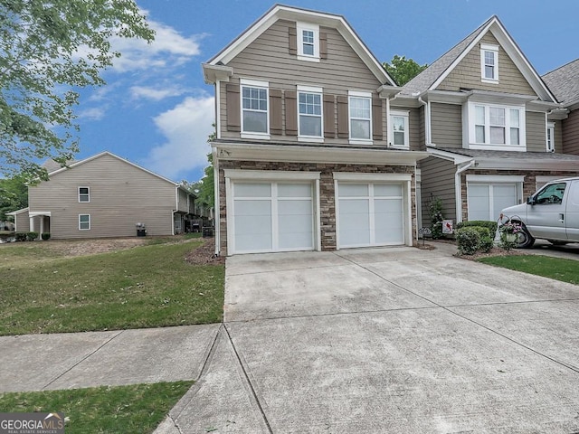 view of front of house featuring a front yard and a garage