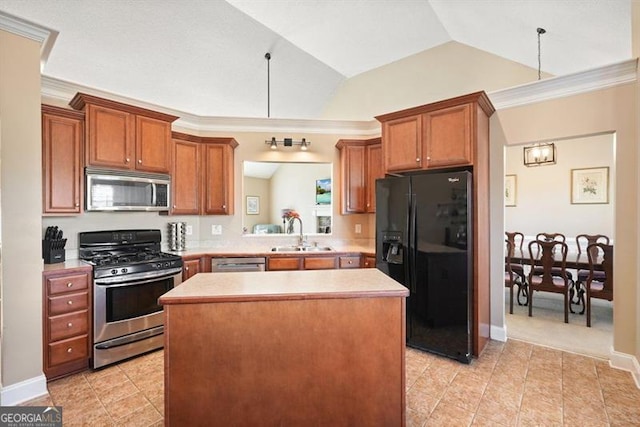 kitchen with stainless steel appliances, crown molding, sink, a kitchen island, and lofted ceiling