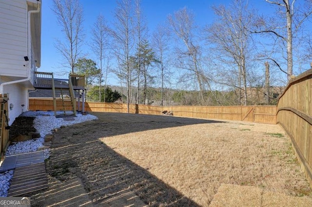 view of yard featuring a wooden deck