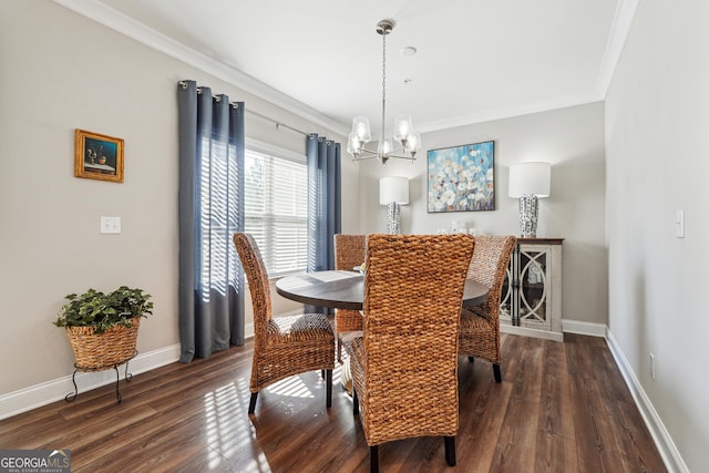 dining area featuring dark hardwood / wood-style floors, ornamental molding, and an inviting chandelier