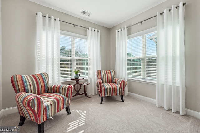 living area with light colored carpet