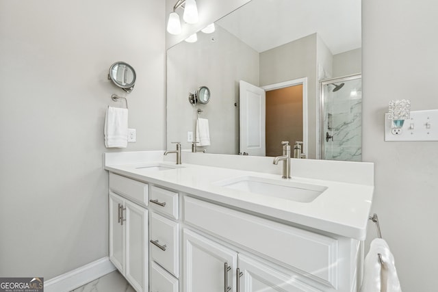 bathroom with a shower with door and vanity