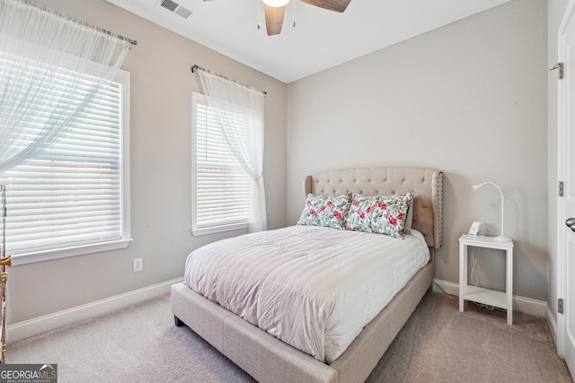 carpeted bedroom with ceiling fan