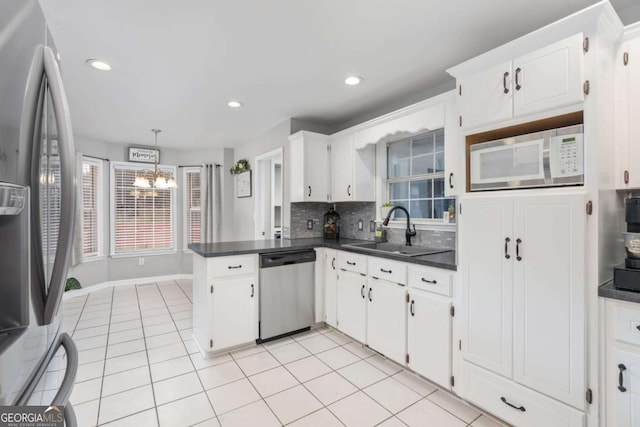 kitchen with white cabinetry, sink, and appliances with stainless steel finishes