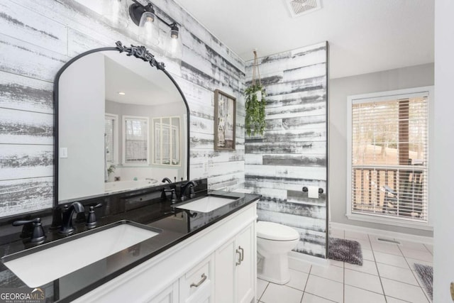 bathroom with tile patterned floors, vanity, and toilet