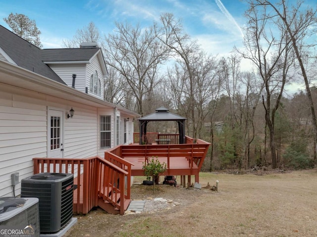 wooden terrace with a gazebo and central AC unit