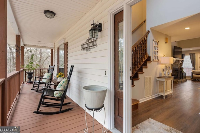 wooden deck featuring covered porch