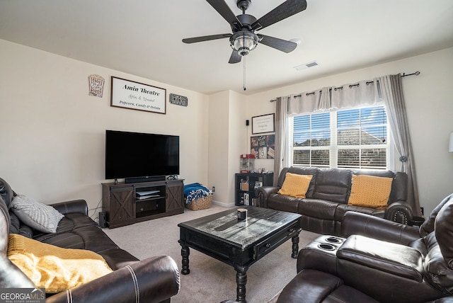 carpeted living room featuring visible vents and ceiling fan