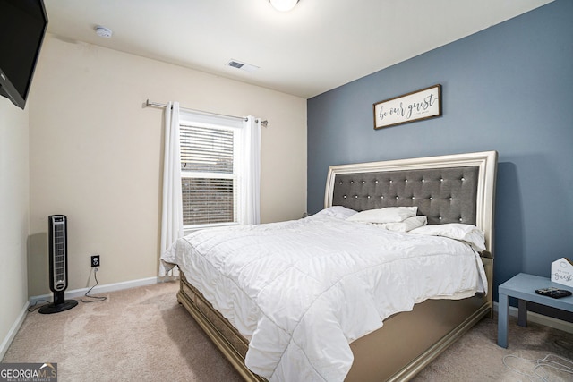 bedroom with carpet, visible vents, and baseboards