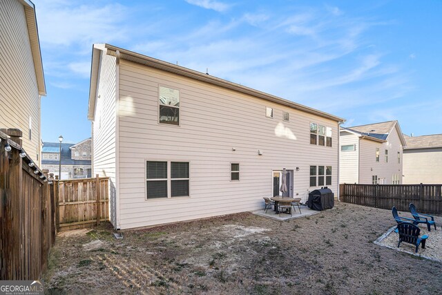 back of house featuring a patio