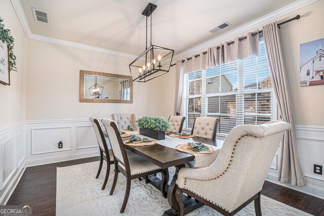 dining space with visible vents, dark wood-style flooring, and ornamental molding