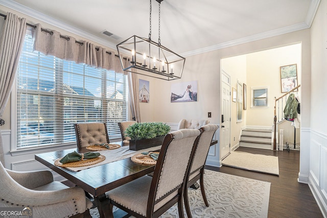 dining area featuring stairs, plenty of natural light, and crown molding