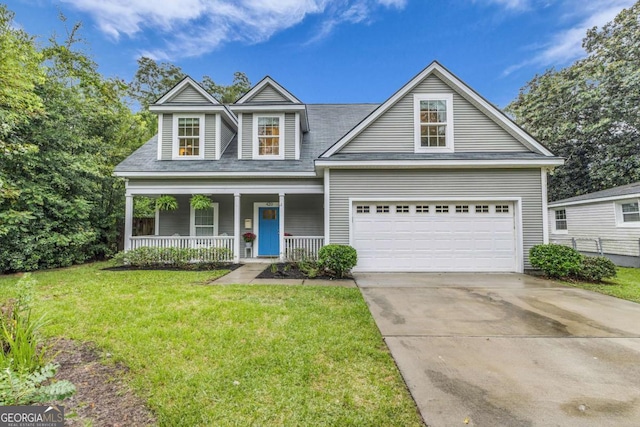 view of front of home featuring a porch, a garage, and a front lawn