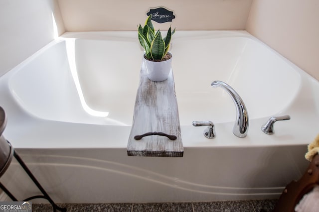 interior details featuring a tub to relax in