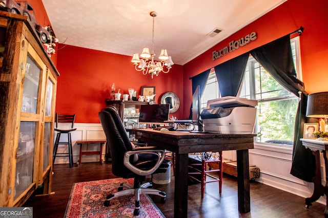 office space featuring an inviting chandelier and dark wood-type flooring