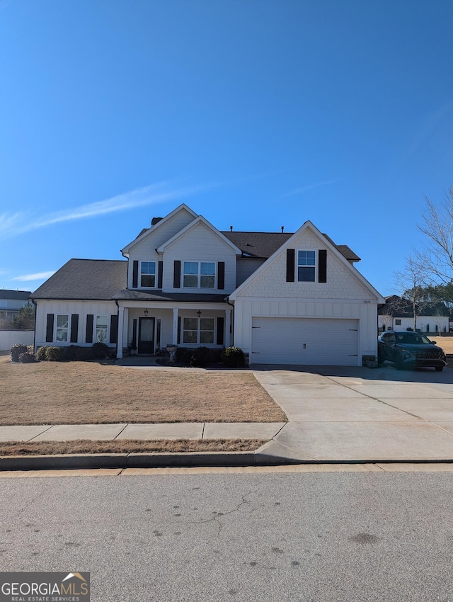 view of front of house with a garage and a front yard