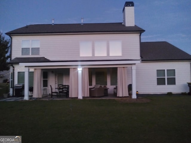 rear view of property with a patio area